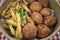 Falafel and french fries, close up view from above