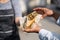 Falafel and fresh vegetables in pita bread. Sale, in the frame of the hand of the cook and the buyer