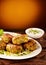 Falafel patties served with sour cream dip