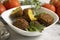 Falafel, tomatoes  gourmet  cooking  on a wooden background nutrition