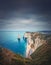 Falaise d\\\'Aval limestone cliffs washed by La Manche channel waters. Beautiful coastline view to the famous rock Aiguille of