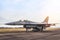 Falcon fighter jet military aircraft parked on the runway