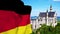 Falg of Germany waving over neuschwanstein castle