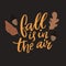Fall is in the air. Inspirational autumn quote, brown leaves and acorns illustrations.