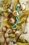 Fall background with coral and turquoise beads, near the dry buds of roses,yellowed leaves,nuts,stones,lined on light plywood