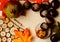 Fall background in vivid color with wooden details, word autumn, pomegranate, leaves and wild chestnuts in shell