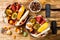 Fall breakfast bowl with chocolate granola, coconut yogurt and autumn seasonal fruits and berries. Healthy vegetarian breakfast