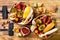 Fall breakfast bowl with chocolate granola, coconut yogurt and autumn seasonal fruits and berries. Healthy vegetarian breakfast