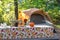 Fall campsite with pumpkins and fresh flowers on a picnic table