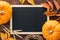 Fall chalkboard background with pumpkins, leaves and wheat