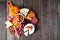 Fall charcuterie board, above view against a dark wood background