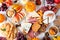 Fall charcuterie table scene against a white wood background