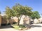 Fall color at townhouse complex with attached garage cars in Dallas, Texas, USA