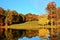 The fall colors of the forest are on display on the mountain ponEach tree lining the mountain pond vie to add more color to the wa