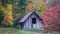 Fall colors surround antique barn in Oct