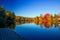 Fall colours foliage with boardwalk on a lake