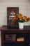 Fall at country house. Seasonal rustic decorations with cozy blankets and flowers