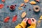 Fall decorations made from natural materials. Making garland with hemp cord and vibrant red Autumn leaves