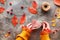 Fall DIY decorations from natural materials. Making floral garland with cord and Autumn leaves