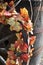 Fall flowers wrapped on a wagon wheel on a Fall day in Groton, Massachusetts, Middlesex County, United States. New England Fall.