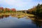 Fall foliage border a blue Adirondack pond