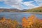 Fall foliage in peak overlooking reservoir