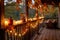 a fall garland wrapped around porch railing and candles