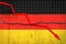 Fall of the Germany Economy. Recession graph with a red arrow on the Germany flag. Economic decline. Decline in the economy of