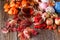 Fall harvesting on rustic wooden background with wool balls