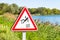 Fall hazard sign and Avignon bridge in a sunny day