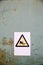 Fall hazard sign on industrial background