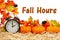 Fall Hours message with a retro alarm clock with pumpkins and fall leaves
