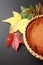 Fall leaves or leafs with black back ground and a pumpkin pie vertical