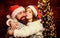 Fall in love. Couple in love enjoy christmas holiday celebration. Family tradition. Loving couple cuddle christmas tree