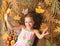 Fall nature gifts. Autumn coziness is just around. Tips for turning fall into best season. Kid girl smiling face lay