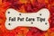 Fall Pet Care Tips on wood dog bone on fall leaves