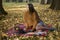 Fall picnic on september. Young woman resting in nature on blanket with book and diary. Autumn mood. People, lifestyle