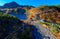 Fall scenery of a hiking trail by beautiful Mikurigaike Pond, a crater lake in Murodo Tateyama, Toyama