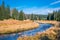 Fall scenery of a river winding through meadows and forests in the Modrava valley, Sumava, Czechia