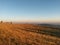 Fall season at the mountain with colorfully trees, meadows and hills