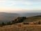 Fall season at the mountain with colorfully trees, meadows and hills