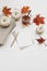 Fall still life. Autumn stationery. Blank greeting card, invitation mockup. Pumpkins, red maple leaves isolated on white
