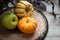 Fall Still Life with Mini Pumpkin, green apple and delicata sweet dumpling squash.  A horizontal with copy space and natural light