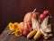 Fall still life with  pumpkins,  corns  and apples against the background of old wooden wall with copy space for text