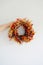 Fall wreath of dried flowers over white