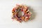 Fall wreath of dried flowers and wooden background