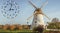 Fallback time. Abstract photo with windmill and Autumn landscape. Time change concept