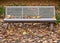 Fallen leaves on autdoor bench