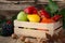 Fallen leaves, winter squash and vegetables in a wooden box. Fall harvest decorating