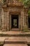 Fallen rocks seen through stone temple doorway